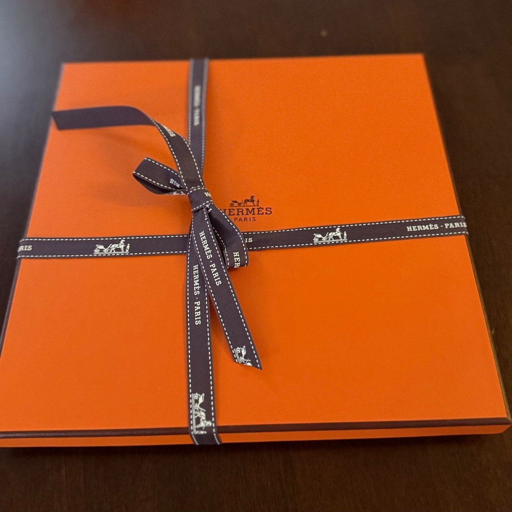 Empty Hermes Orange scarf box with ribbon and tissue